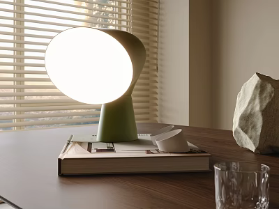 Green Table Lamp Illuminates On Books With Small Cup And Stone Near Window Blinds 3d model