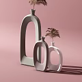 White Vases With Unique Oval Cutout Design And Palm Leaf In Pink Background