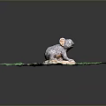 Koala Sculpture on Green Grass with Stone Base and Gray Orange Fur