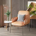 Orange Leather Single Sofa With Black And White Checkered Pillow And Small Round Side Table 3d model