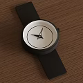 Minimalist Wristwatch With Black Strap White Dial And Black Hands On Wooden Surface