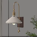 Modern Wall Lamp with White Pleated Lampshade Gold Arm Wooden Base and Plant Near Wall