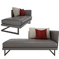Modern Gray Leather Chaise Lounge With Red And Beige Pillows And Metal Legs