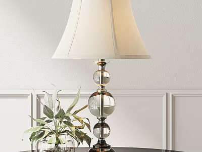 Ivory Lampshade Table Lamp with Glass Globe Base and Green Plant against White Wall Paneling 3d model