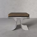 Modern Stainless Steel Stool With Brown Cushioned Seat And Curved Frame Design