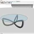 Modern Coffee Table With Glass Top And Black Intertwined Metal Base Design