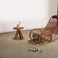 Modern Wicker Rocking Chair In Indoor Setting With Round Rug And Side Table