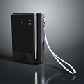 Black Vintage Electronic Device with Striped Surface and White Cable