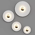 Modern Circular White Wall Lamps With Radial Stripes And Gold Bulbs On Gray Wall