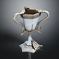 Intricate Sculpted Silver Vessel With Dragon Decorations Ornate Handles And Artistic Carving Details