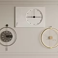 Three Stylish Wall Clocks Featuring Different Designs On Framed White Wall