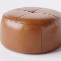 Brown Leather Round Stool with Smooth Surface and Stitched Design for Modern Interior Spaces