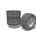 Heavy Duty Truck Tires Stacked With Weathered Metal Wheel Rims