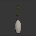 Green Leaf Plant With Slender Stem In White Hexagonal Textured Vase On Dark Background