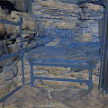Rustic Stone Wall Interior With Metal Frame Structure And Narrow Passageway