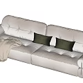 Modern Cream Sectional Sofa With Dark Throw Pillows And Light Blanket 3d model