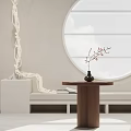 Round Wooden Side Table with Vase and Dried Flowers near White Sofa in Minimalist Interior