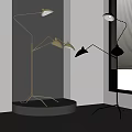 Modern Floor Lamps With Brass And Black Shades In Interior Display Setting