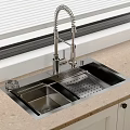Stainless Steel Kitchen Sink With Pull Down Faucet On Beige Countertop And Cabinets