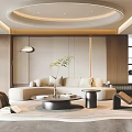 Modern Living Room Interior Featuring Beige Sofa Round Coffee Table Floor Lamp And Green Plant