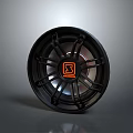 Modern Black Car Tire Rim Featuring Orange Sport Logo And Metallic Spokes