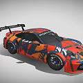 Porsche Race Car With Orange And Blue Camouflage Design And Rear Spoiler