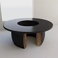 Round Black Dining Table With Central Circular Cutout And Brown Wooden Legs