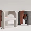 Stylish Modern Accent Chairs With Curved Arms And Brown Throws In Two Tones