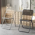 Transparent Leisure Chairs with Silver and Black Metal Frames in Modern Interior Design