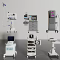 Multiple Mobile Medical Devices Featuring Monitoring Screens And Surgical Equipment Carts