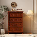 Dark Brown Chest of Drawers with Potted Plant Floor Lamp and Books on Rug
