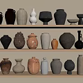 Ceramic Vessels Displayed on Three Tiered Shelves With Various Colors Different Shapes And Sizes
