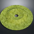 Green Circular Jade Artifact With Central Hole And Intricate Textured Surface