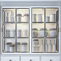 Wooden And White Decorative Cabinets Filled With Bottles Jars And Decor Items