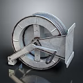 Industrial Metal Cable Reel With Handle And Worn Metallic Finish On Dark Background