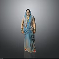 Woman Wearing Blue Sari with Gold Necklace and Bracelets on Shiny Floor