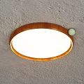 Modern Round Wooden Frame Ceiling Light With White Lampshade On Gray Textured Ceiling
