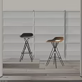 Modern Black And Tan Bar Stools With Metal Bases In Bright Interior With Large Windows