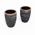 Two Black Ceramic Pots With Handcrafted Texture And Cylindrical Open Mouth Design