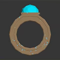 Elegant Ring With Blue Gemstone On Top And Intricate Metallic Band With Small Blue Accents