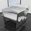 Silver Metallic Sofa In Room Featuring Black Speckled Floor White Textured Wall Window Sky View