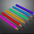 Colorful Pencils Arranged in Row with Multiple Vibrant Colors on Black Surface