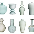 Decorative Ceramic Vessels With Various Shapes Soft Colors And Textured Surfaces