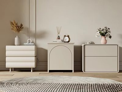 Three Light Colored Bedside Tables In Different Designs With Vases Aromatherapy Clock And Books 3d model