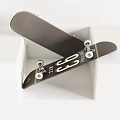 Stylish Black Skateboard With White Logo Gold Accents Metal Trucks And White Wheels