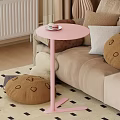 Pink Round Functional Table Next to Sofa With Cup Saucer on Top and Stuffed Toy