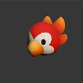 Red Orange Bird Toy With White Face Black Eyes On Black Surface With Reflection