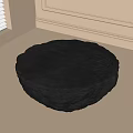 Round Dark Coffee Table With Branch Like Carvings In Light Colored Room With Window