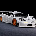 White High Performance Sports Car With Orange Alloy Wheels Sleek Aerodynamic Body And Rear Spoiler