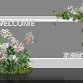 Welcome Themed Photo Check-in Spot With White Frame Flowers And Green Plants